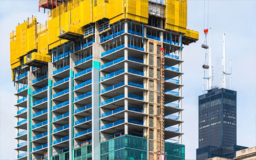 A close up of the Essex Hotel getting the glass installed.