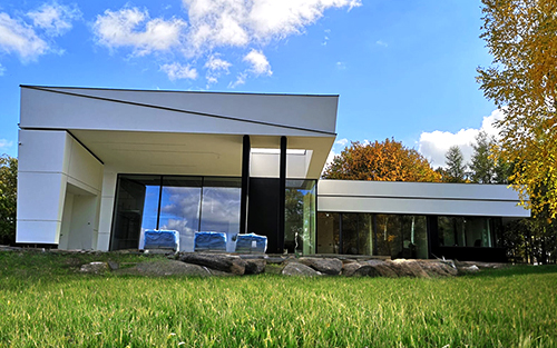 Modern home with tall glass windows and walls.